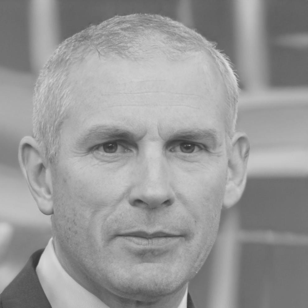 Professional male instructor with expertise in financial modeling and valuation