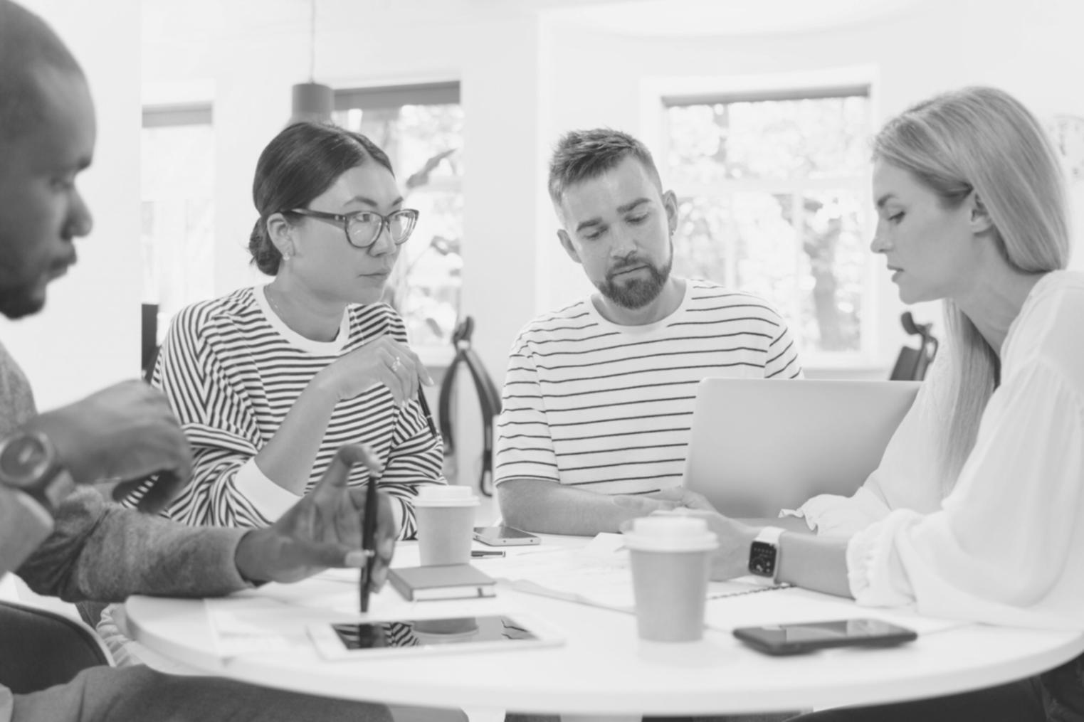 Financial analysts working with valuation models in professional setting